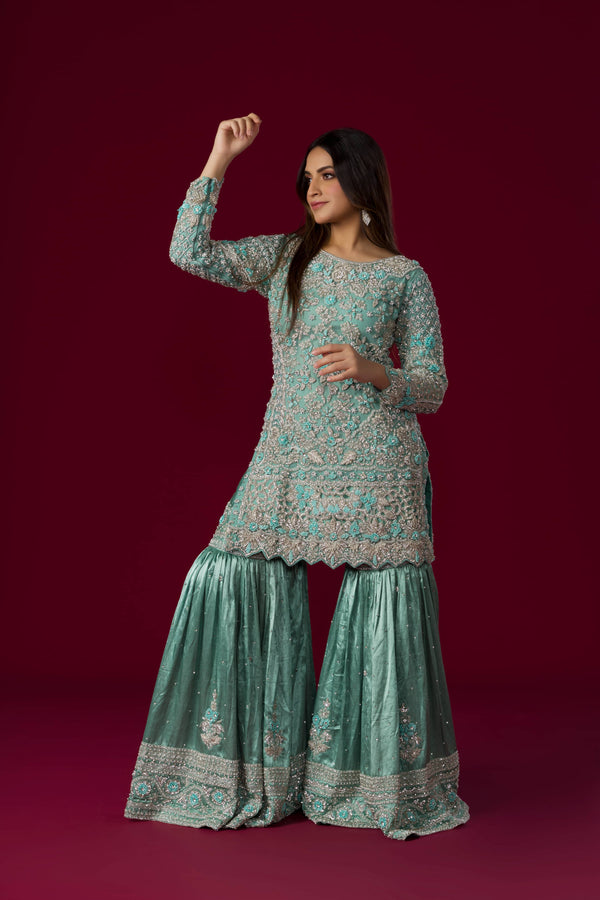 Turquoise Short Kurta And Sharara Suit Embellished in Heavy Zari And Stone Work