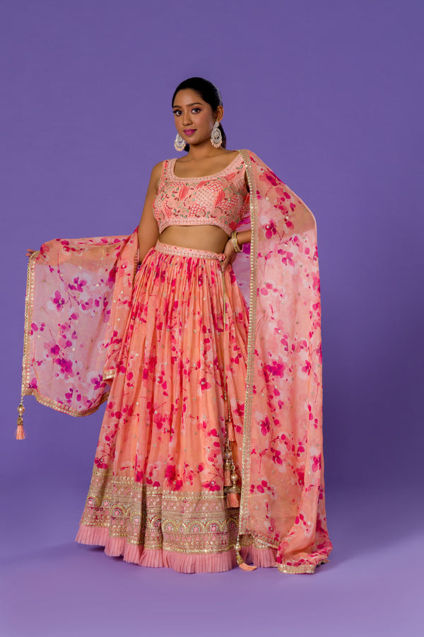 Peachy Floral Breeze Printed Lehenga Choli With EmbroideryPaired With Gota Bordered Floral Printed Dupatta